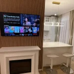 mantle place and kitchen view